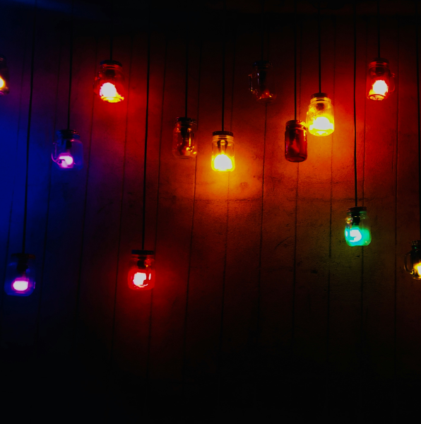 Colored lights inside small hanging jars