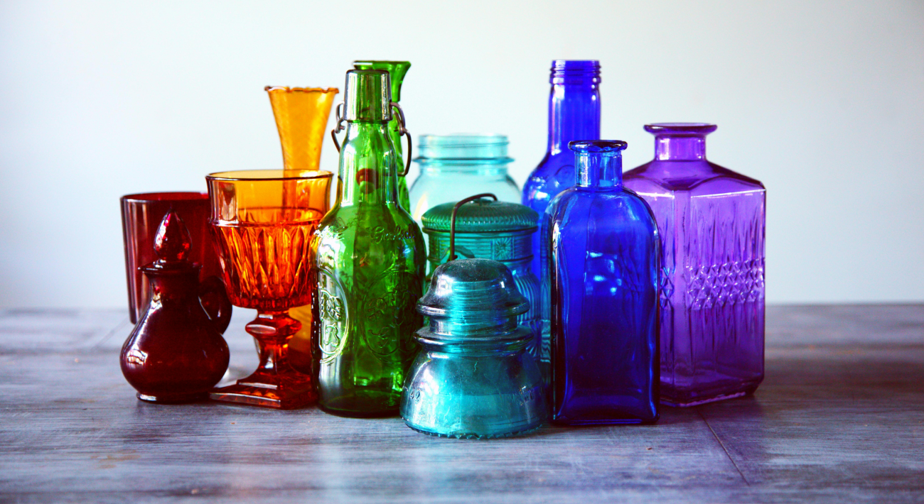 Various glass objects in different colors. They range from red to purple.