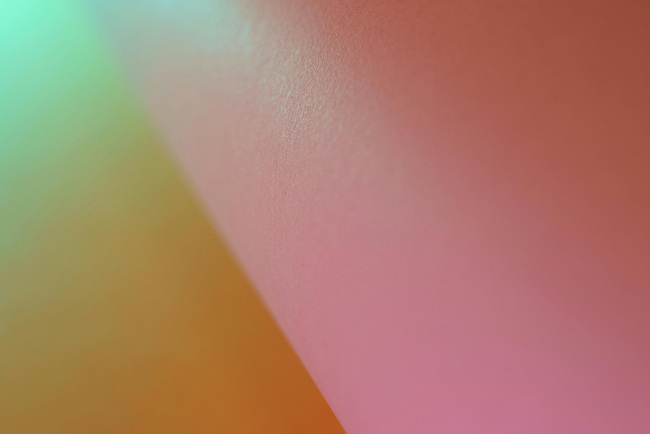 Representation of secondary colors: an artistic photo featuring shades of purple, orange, and green.