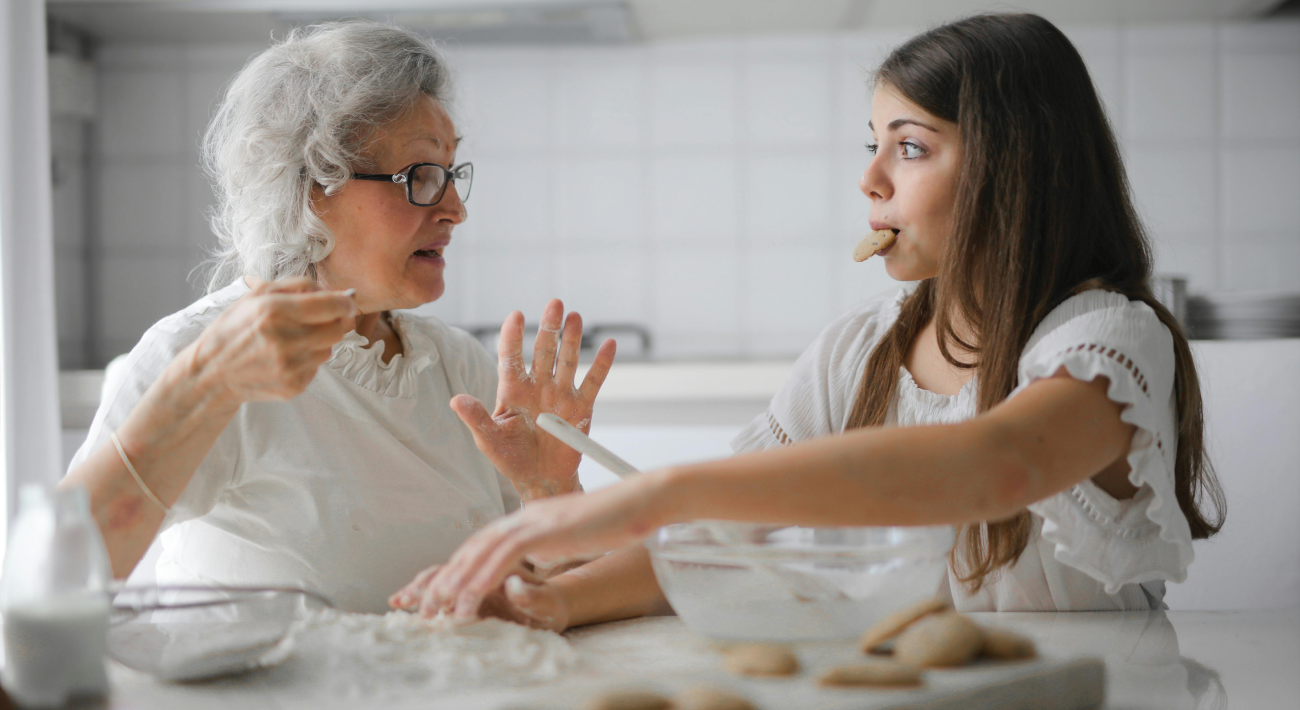 How to Feel Good at Home: A young girl and her grandmother enjoy baking cookies together.