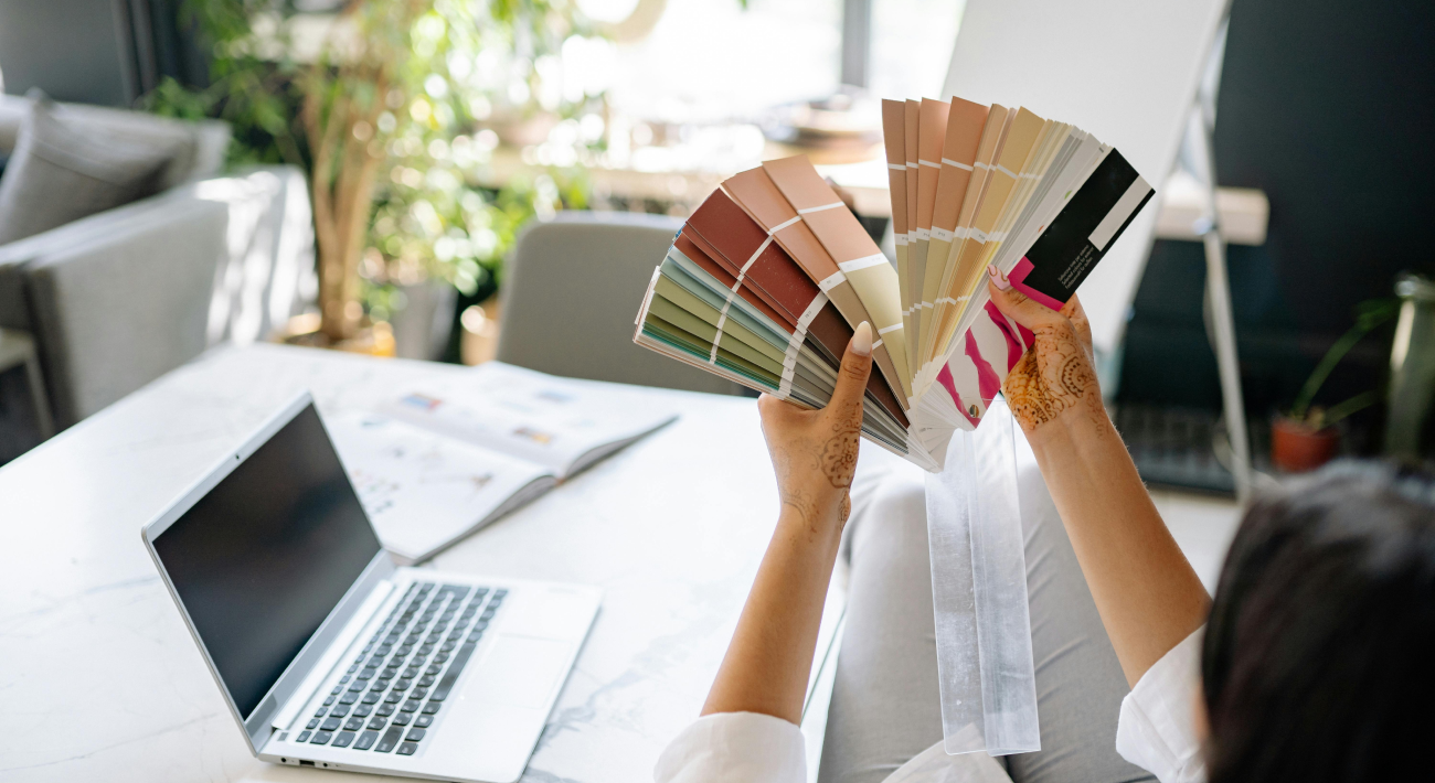 Selecting paint to color your home from a wide palette of colors.