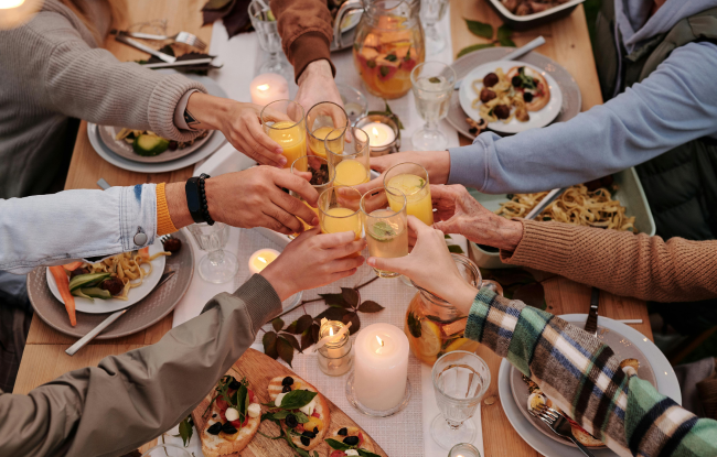 A family toast during an outdoor dinner