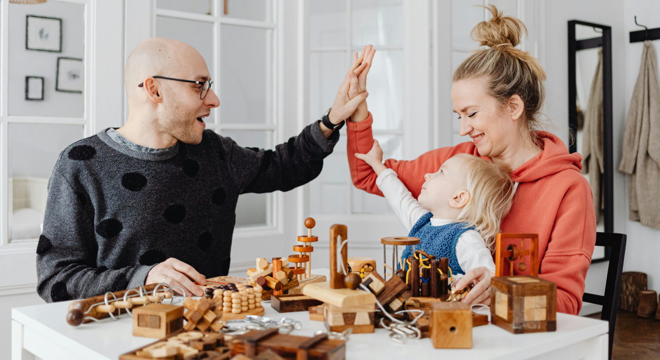 Playing at home: A mother and father play with their young child.