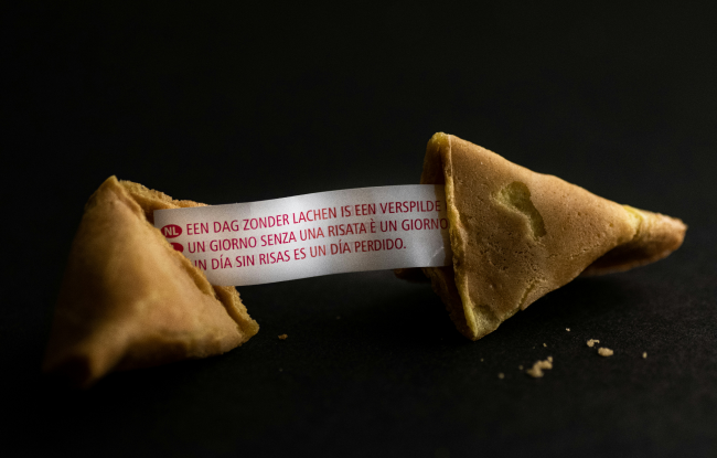 Fortune cookie opened to symbolize rebirth after enduring karmic wounds.